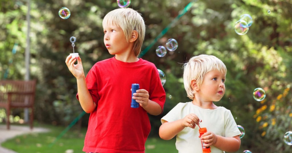 boys blowing bubbles