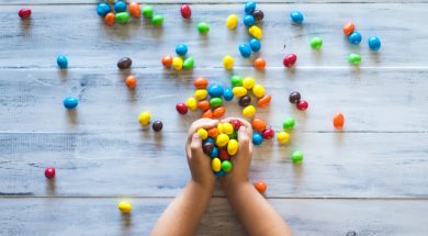kid-holding-coloured-candy-2.jpg