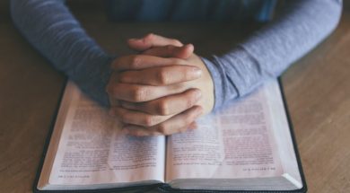 Person-praying-with-Bible-Open-Unsplash.jpg