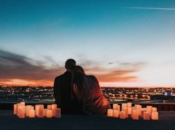 Couple-watching-sunset-over-city.jpg