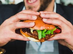 Man-eating-a-burger-by-Sander-Dalhuisen-on-Unsplash-.jpg