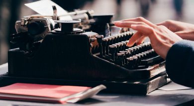 Woman-typing-on-typewriter-by-Thom-Milkovic.jpg