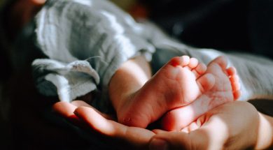 Parents-hand-holding-babys-feet.jpg
