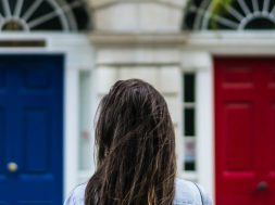 Woman-choosing-between-blue-and-red-doors.jpg